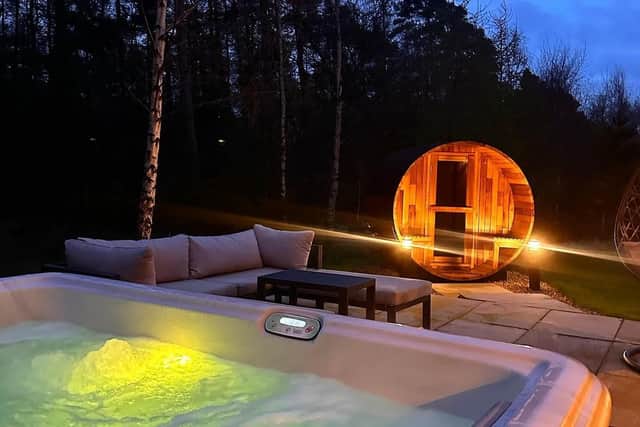 Private hot tub and sauna at couples lodge, Olive.