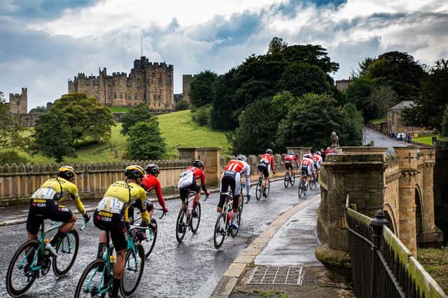 The peleton passes Alnwick Castle in the 2019 Tour of Britain. Picture by Zac Williams/SWpix.com