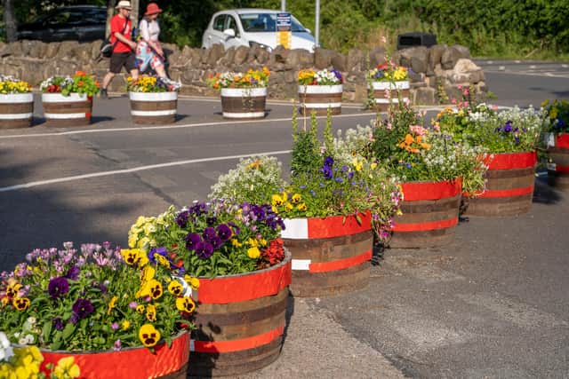 The floral tubs are at the entrance to Craster. Picture: Jane Coltman