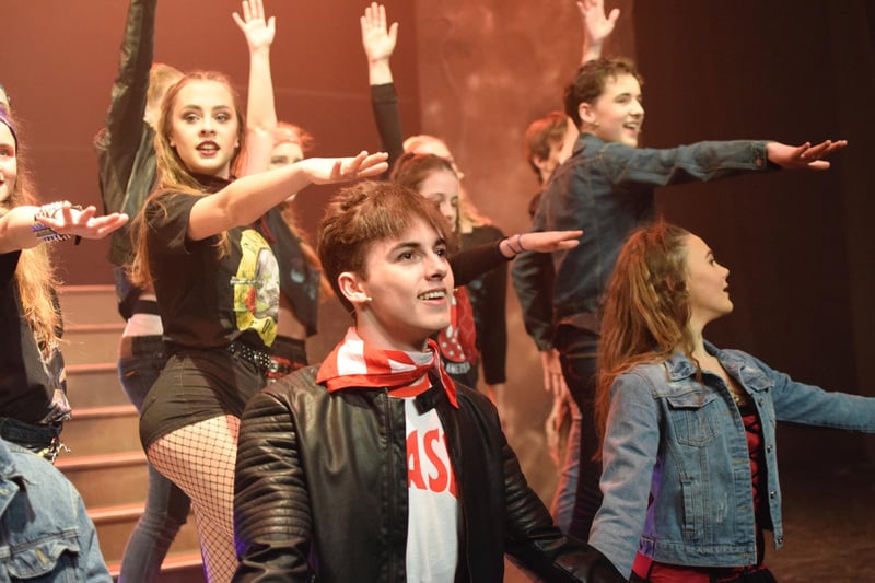 The cast perform one of the many musical numbers in The Queen musical We Will Rock You by Duchess's Community High School students at Alnwick Playhouse.