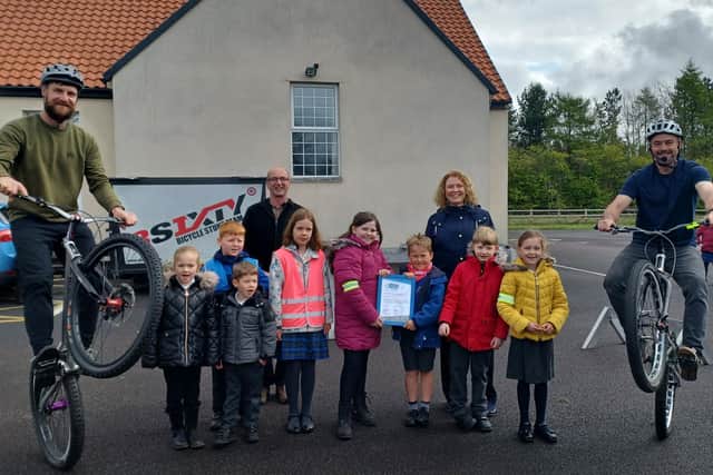 Pupils from Stannington First School in Northumberland received the Modeshift STARS platinum award from Coun John Riddle following a display from the 3SIXTY bicycle stunt team.
