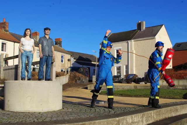 Station Officer Jonathan Lamberth and Coastguard Rescue Officer Geoff Barrett at Newbiggin's iconic statues of the sea Ebb and Flow using their throwbags as part of the Coastguards 200th birthday.