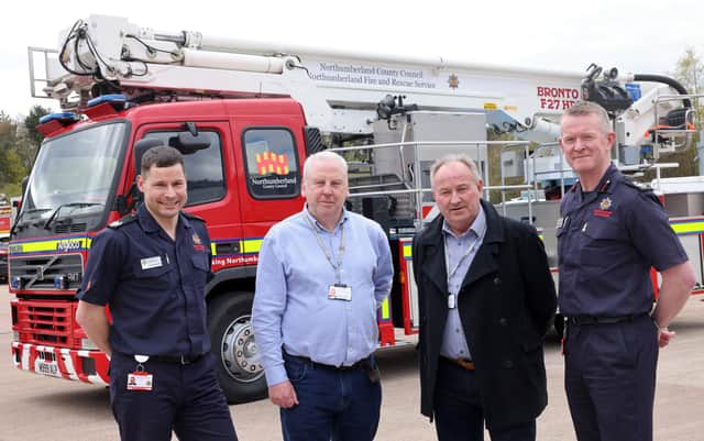 Joe Haustead, Cllr Gordon Stewart, Cllr Colin Horncastle and Graeme Binning with the new aerial ladder platform (ALP) at Northumberland Fire and Rescue Service.