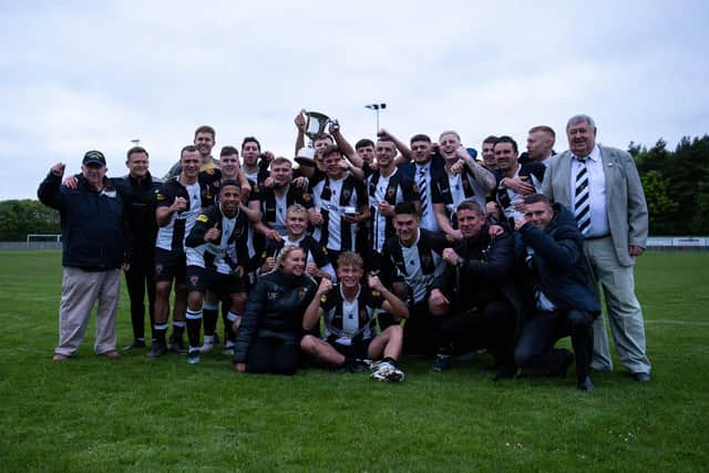 Alnwick Town players and staff celebrate victory in the George Dobbins League Cup. Picture: John V Mason