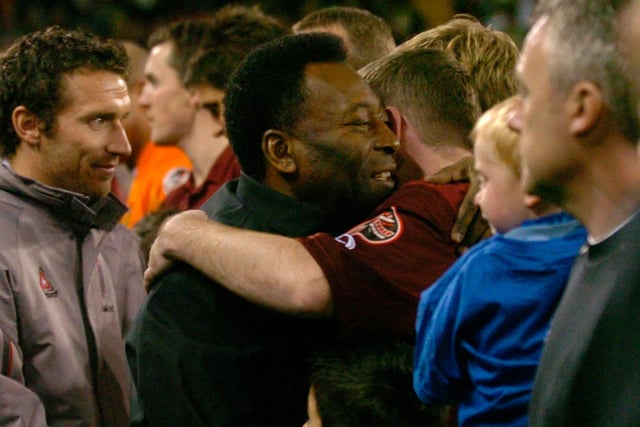 Brazilian Legend Pele meets the players on the pitch at Bramall Lane