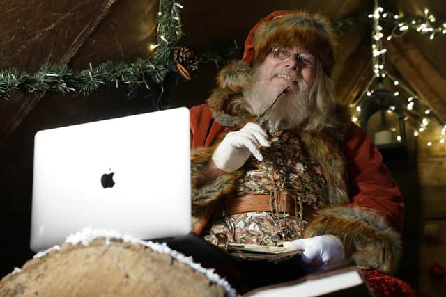 Bamburgh Castle Santa Rhod Maclennan learnt to do Zoom calls from his grotto due to Covid-19. Picture: Owen Humphreys