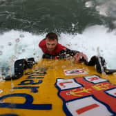 Lifeguard Matthew out on the rescue board during a patrol at Coldingham Bay. Picture: RNLI
