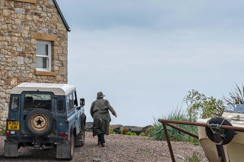 Vera (Brenda Blethyn) makes her way round the side of the house where filming took place in Boulmer village.