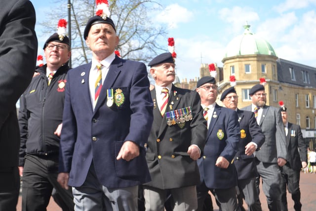 Veterans marching through the town centre.