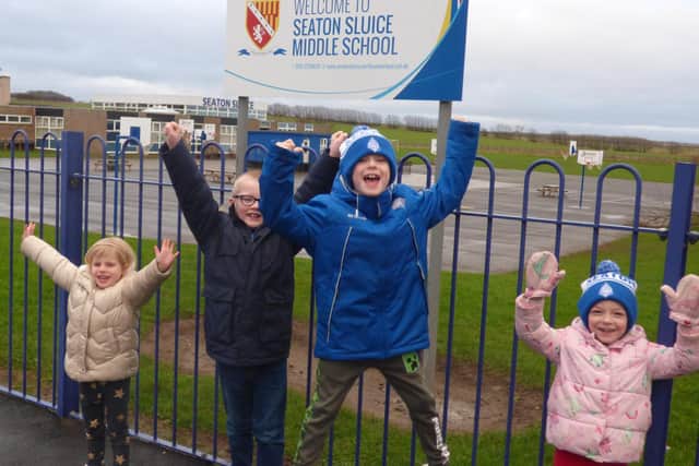 Children Olivia Dunlop, Thomas Howitt, Jake Gomm, and Halle Gomm are delighted at the news they will be attend Seaton Sluice Middle School at its current site.