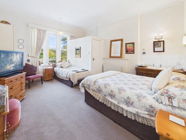 One of nine generous bedrooms.