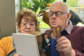 Norman and Eileen Adam with their card from King Charles and Queen Camilla.