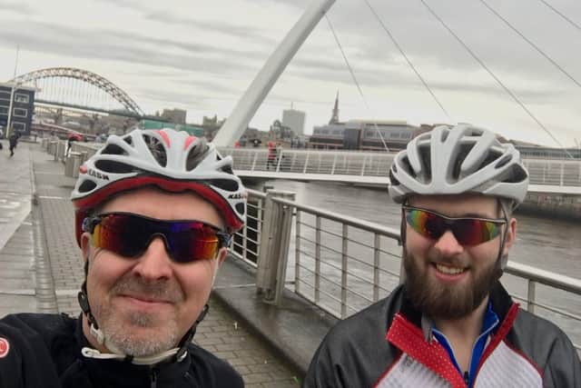 David and Adam by the Newcastle-Gateshead Millennium Bridge. (Photo submitted by Brain Tumour Research).
