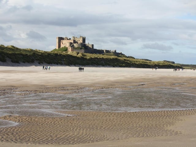 The historic Bamburgh Castle is said to be haunted by the 'Pink Lady'. Reports of paranormal activity includes a body-less hand seen in the dunes, a knight guarding the battlements, unexplained noises, and shadows.