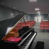 The concert room at the new music school features a grand piano. (Photo by YMS)