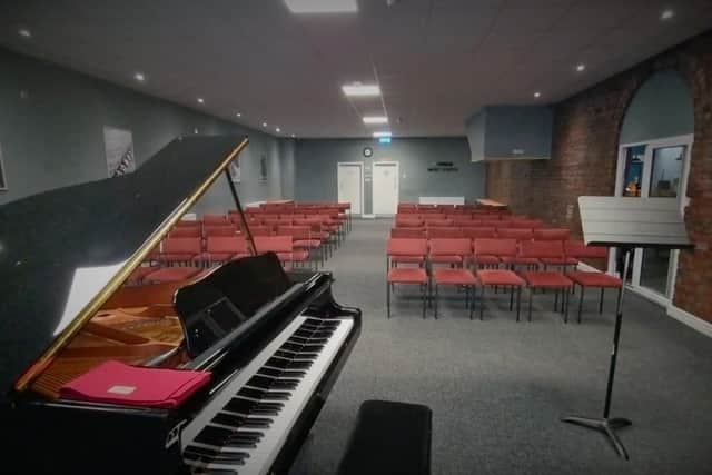 The concert room at the new music school features a grand piano. (Photo by YMS)