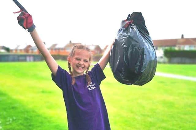 Sophie with some of the rubbish she has collected