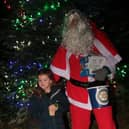 Santa with his little helper at the Togston switch on.