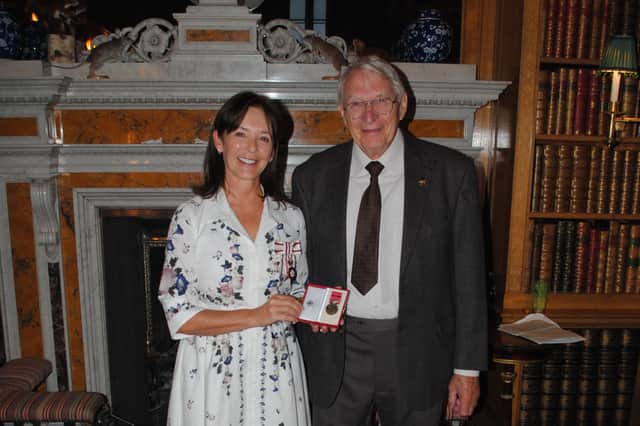 Eric Dickson receives his British Empire Medal from Her Grace the Duchess of Northumberland.