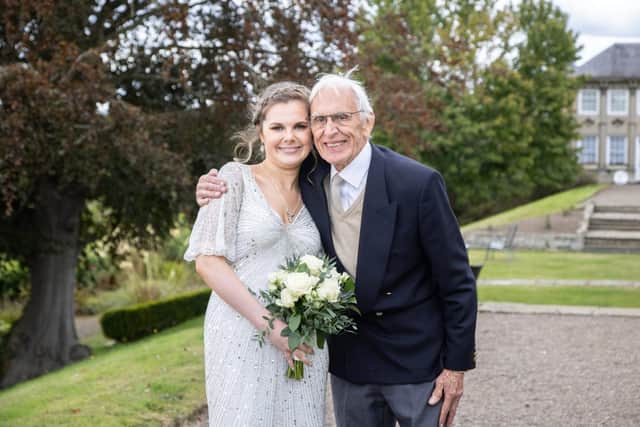 Ray with his granddaughter Lizzie Swallow at her wedding in September.