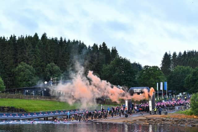 Triathletes head into Kielder Water to start their race at The Northumbrian