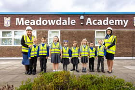 Amanda Alison (head teacher) with Jack, Franky-Ray, Eden, Hope, Rudy, Freya, Alfie and Lucas from years one and two with Dee Nguyen (Miller Homes development sales manager).
