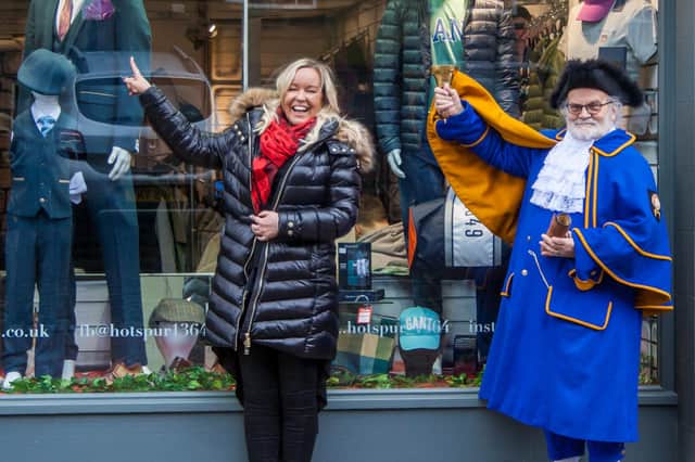 Lisa Aynsley (Alnwick Chamber of Trade) and Town Crier Jolly Roger launch the Lionheart Radio window spotting competition.