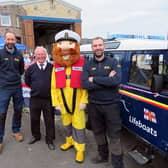 Station coxswain/mechanic Craig Pringle, harbourmaster Brian Wilson, Stormy Stan (Volunteer cox'n Keith Slater) and station mechanic Graeme Trotter.