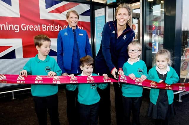 Team GB Judo hero Gemma Gibbons cuts the red ribbon alongside Bedlington West End County First School students at the new Aldi store in Bedlington.
