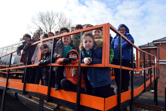 Children at the Dales School on their new train platform.