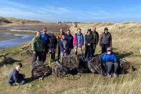 Litter-picking volunteers on Holy Island at the last clean-up event.