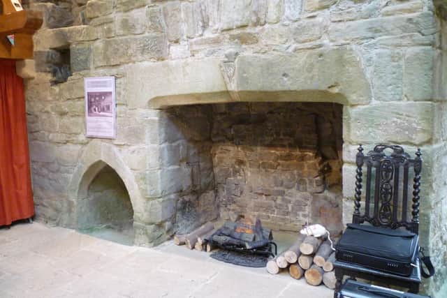 The kitchen fireplace and slop stone.
