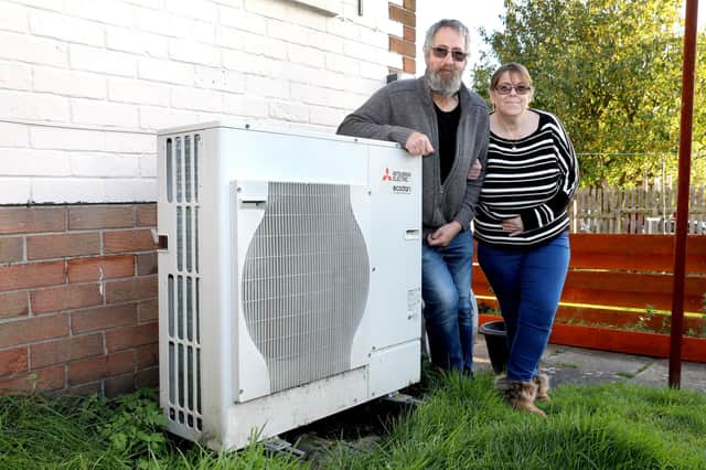 Stephen and Claire Riddell with their Air Source Heat Pump.