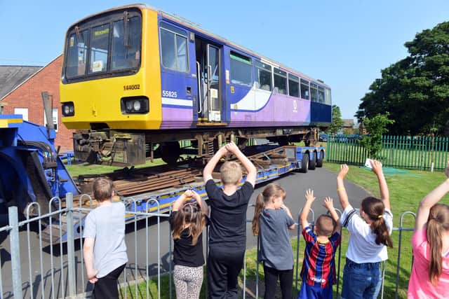 Children at The Dales School, Blyth, welcome a train donated by Network Rail.