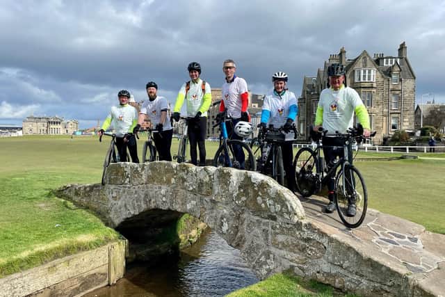 The bike ride participants pictured on the famous Swilcan Bridge at St Andrews on the final day of the challenge.