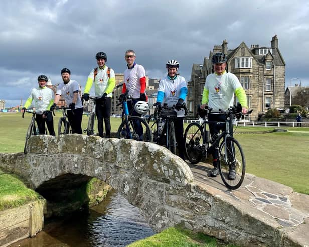 The bike ride participants pictured on the famous Swilcan Bridge at St Andrews on the final day of the challenge.