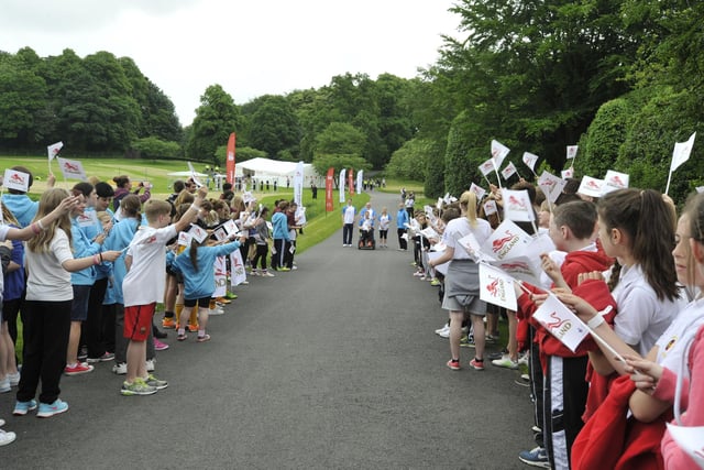 Pupils line up to welcome the baton.
