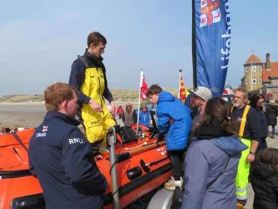 Visitors to the open day get a closer look at the inshore lifeboat.