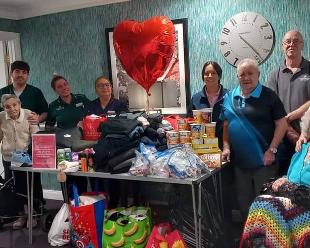 Staff and residents at Station Court with the items collected for Streetworx. (Photo by Barchester Healthcare)