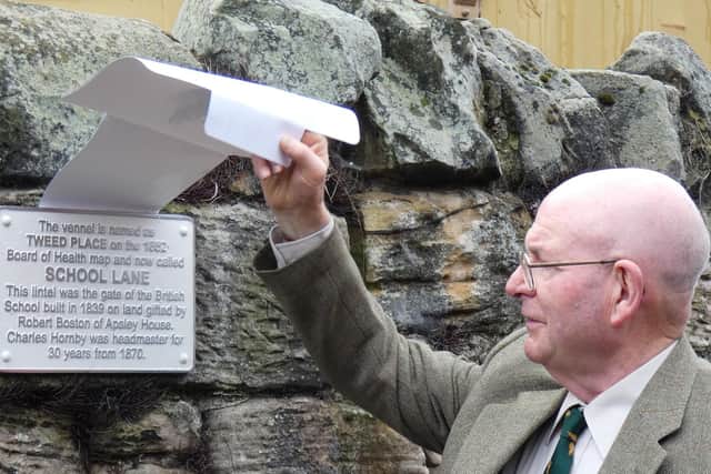 Robert Ashworth unveils the ‘School Lane’ plaque.