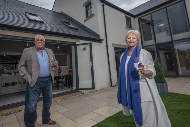 Rachel Rist with Platinum’s chairman and managing director outside the West Chevington Farm show home.