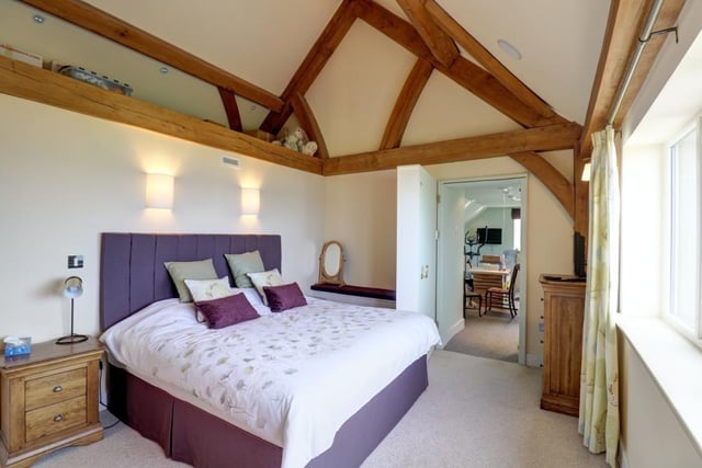 The landing and all the bedrooms have oak beamed vaulted ceilings.