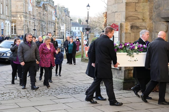 Family and friends arrive at Hexham Abbey to say their final farewells.