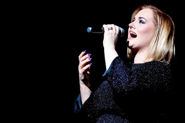 Katie Markham performing Adele's songs on tour.