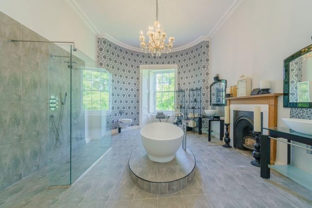 This bathroom has a large freestanding bath and walk-in shower.