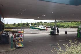 The air ambulance has landed near the petrol station at the Morrisons in Berwick.