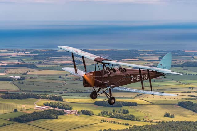 A vintage Tiger Moth plane will be flying in the sky above Northumberland.