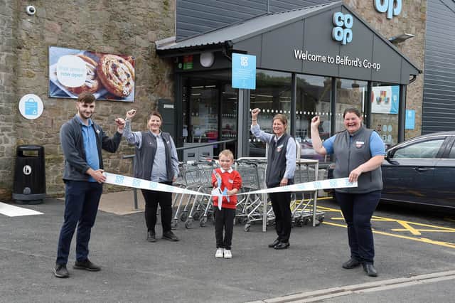 Store manager Tammy Robson, second from right, and staff, Joseph Threlfall, Lisa Court and Louise Melvin, with help from Ewan Middleton, one of the pupils from Belford Primary School, officially open the new-look Co-op. Picture by Chris Watt, www.chriswatt.com