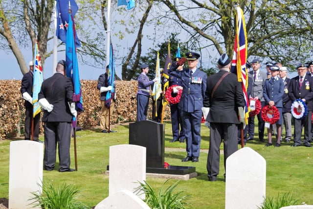 RAF Boulmer Station commander Stephen Henderson salutes after laying his wreath.