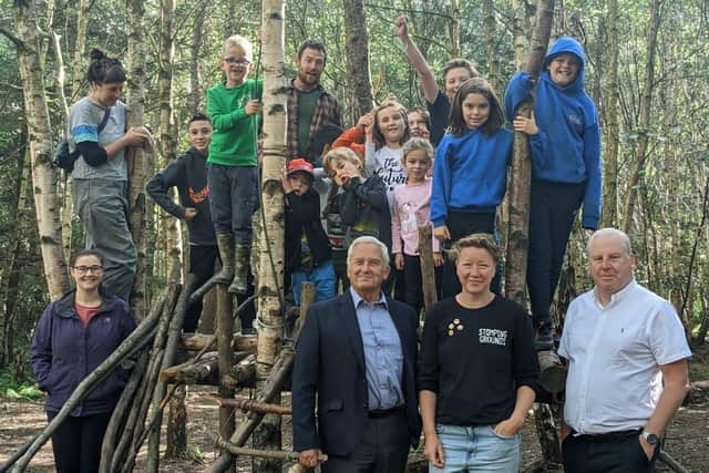 (L-R) Council leader Glen Sanderson, director of Stomping Grounds Forest School Sophie Watkinson, and local councillor Gordon Stewart with members of the school.